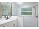 Modern glass enclosed shower featuring white marble tiling and gold fixtures and accents at 10470 Sw 139Th Ct, Dunnellon, FL 34432