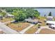 Aerial view of a waterfront house with mature trees and a long driveway at 118 Lake Sears Dr, Winter Haven, FL 33880