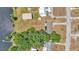 Aerial view of lakefront homes showcasing their proximity to the water with lush trees and expansive lots at 118 Lake Sears Dr, Winter Haven, FL 33880