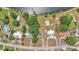 Aerial view of neighborhood homes near the lake, each with distinct architectural styles and mature trees at 118 Lake Sears Dr, Winter Haven, FL 33880