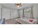 Bedroom featuring neutral paint, carpet, two windows, and a ceiling fan at 118 Lake Sears Dr, Winter Haven, FL 33880