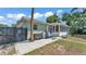Outdoor patio with modern gray metal fencing and a grill at 118 Lake Sears Dr, Winter Haven, FL 33880
