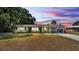 Inviting home exterior with a covered carport and lush greenery at 118 Lake Sears Dr, Winter Haven, FL 33880