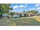 Charming home with a well-kept lawn and mature trees at 118 Lake Sears Dr, Winter Haven, FL 33880