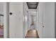 Hallway with neutral paint color and hardwood flooring at 118 Lake Sears Dr, Winter Haven, FL 33880