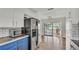 Open kitchen with stainless steel appliances and view to screened porch at 118 Lake Sears Dr, Winter Haven, FL 33880