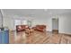 Bright and spacious living room with hardwood floors and large windows at 118 Lake Sears Dr, Winter Haven, FL 33880
