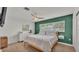 Cozy main bedroom with bright accent wall and ample natural light at 118 Lake Sears Dr, Winter Haven, FL 33880