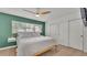 Comfortable main bedroom with a ceiling fan, large windows, and closet at 118 Lake Sears Dr, Winter Haven, FL 33880