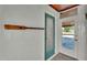 Outdoor space with blue door, white cinderblock, and light tile flooring at 118 Lake Sears Dr, Winter Haven, FL 33880