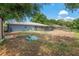 Spacious backyard featuring a mix of cleared areas and lush green spaces at 120 Bolender Rd, Auburndale, FL 33823