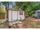 Storage shed with a door and a window in the backyard at 120 Bolender Rd, Auburndale, FL 33823