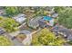 Aerial view showing in-ground pool, brick pathway, and well-maintained landscaping at 1421 Camphor Dr, Lakeland, FL 33803