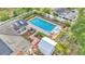 Aerial view of backyard showing in-ground pool, brick trim, and manicured landscaping in a fenced yard at 1421 Camphor Dr, Lakeland, FL 33803