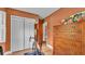 Bedroom featuring an exercise bike, vintage dresser, and wood-look laminate flooring at 1421 Camphor Dr, Lakeland, FL 33803