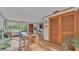 Dining room with hardwood floors, natural light, and access to the bar at 1421 Camphor Dr, Lakeland, FL 33803