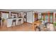 Dining room features a bar, hardwood floors, and classic wood trim at 1421 Camphor Dr, Lakeland, FL 33803