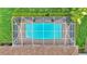 Aerial view of the screened-in pool, showcasing the layout and surrounding landscaping at 146 Woodside Dr, Lakeland, FL 33813