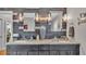 This bathroom features a dual sink vanity, granite countertop, and modern fixtures at 146 Woodside Dr, Lakeland, FL 33813