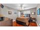 Bright bedroom features hardwood floors, neutral walls, and a ceiling fan at 146 Woodside Dr, Lakeland, FL 33813