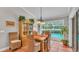 Charming dining area with a view of the pool and backyard at 146 Woodside Dr, Lakeland, FL 33813