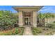A welcoming entryway with decorative landscaping and a covered porch at 146 Woodside Dr, Lakeland, FL 33813
