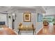 Hallway featuring stylish decor and leading to the kitchen and dining area at 146 Woodside Dr, Lakeland, FL 33813