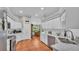 Spacious kitchen with white cabinets, stainless appliances, and an adjacent dining area at 146 Woodside Dr, Lakeland, FL 33813