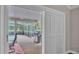 View of screened lanai with grill, outdoor seating, and a view of the pool at 146 Woodside Dr, Lakeland, FL 33813