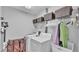 Functional laundry room with washer, dryer, and ample storage space at 146 Woodside Dr, Lakeland, FL 33813