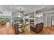 Inviting living room featuring fireplace, tile floors, and patio access at 146 Woodside Dr, Lakeland, FL 33813