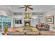 Comfortable living room featuring a fireplace and access to outdoor patio seating at 146 Woodside Dr, Lakeland, FL 33813