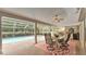 Outdoor patio with a dining area, overlooking a screened-in pool at 146 Woodside Dr, Lakeland, FL 33813