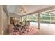 Covered patio features a dining area and a view of the pool at 146 Woodside Dr, Lakeland, FL 33813