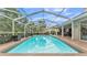 Inviting screened-in pool offers a refreshing escape with a brick patio and plenty of space for outdoor entertaining at 146 Woodside Dr, Lakeland, FL 33813