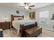 Comfortable bedroom with a wooden bed frame, and a window at 1519 Blue Sky Blvd, Haines City, FL 33844