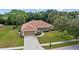 Charming single Gathering home with a well-manicured lawn, 2-car garage, and beautifully landscaped front yard at 1519 Blue Sky Blvd, Haines City, FL 33844