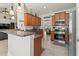 Kitchen featuring stainless steel appliances, granite countertops, and cabinetry at 1519 Blue Sky Blvd, Haines City, FL 33844