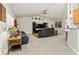 Open-concept living area featuring comfortable leather seating, tv and decor at 1519 Blue Sky Blvd, Haines City, FL 33844
