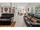 Inviting living room showcasing neutral tones, tile floors and an open concept leading to the dining area at 1519 Blue Sky Blvd, Haines City, FL 33844