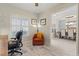 Cozy office space with wood-look tile floors, chair, and plenty of natural light at 1519 Blue Sky Blvd, Haines City, FL 33844