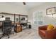 Functional office featuring a large workstation, comfortable chair, and natural lighting at 1519 Blue Sky Blvd, Haines City, FL 33844