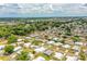 Panoramic aerial shot of a thriving mobile home community with ample green spaces at 1565 Heather Hill Dr, Lakeland, FL 33810
