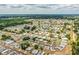Aerial view showcases a community with well-maintained homes at 1565 Heather Hill Dr, Lakeland, FL 33810
