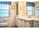 Bathroom view with a toilet, sink, and cabinet at 1565 Heather Hill Dr, Lakeland, FL 33810