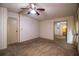 Bedroom featuring carpet, wallpaper, a ceiling fan, and mirrored closet at 1565 Heather Hill Dr, Lakeland, FL 33810