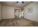 Bedroom featuring carpet, wallpaper, a mirrored closet, and a window at 1565 Heather Hill Dr, Lakeland, FL 33810