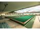 A view of the community's bocce ball courts, with seating and shade at 1565 Heather Hill Dr, Lakeland, FL 33810