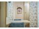 Charming dining area with floral wallpaper, a cozy table, and bright natural light, perfect for intimate meals at 1565 Heather Hill Dr, Lakeland, FL 33810