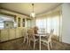 Dining room featuring wood furniture, cabinetry, and window, creating an inviting space for meals and gatherings at 1565 Heather Hill Dr, Lakeland, FL 33810